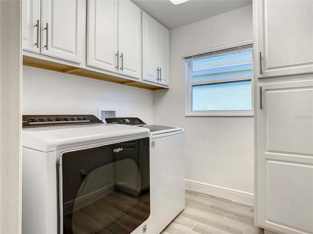 Large Laundry Room with cabinet storage!