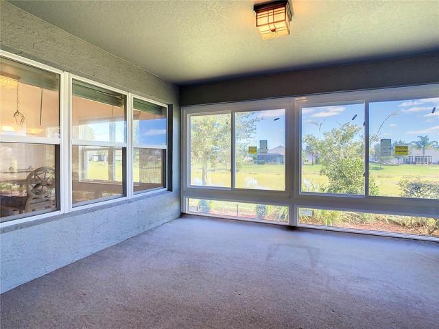 1 of 2 screened in back Porches facing Pond!
