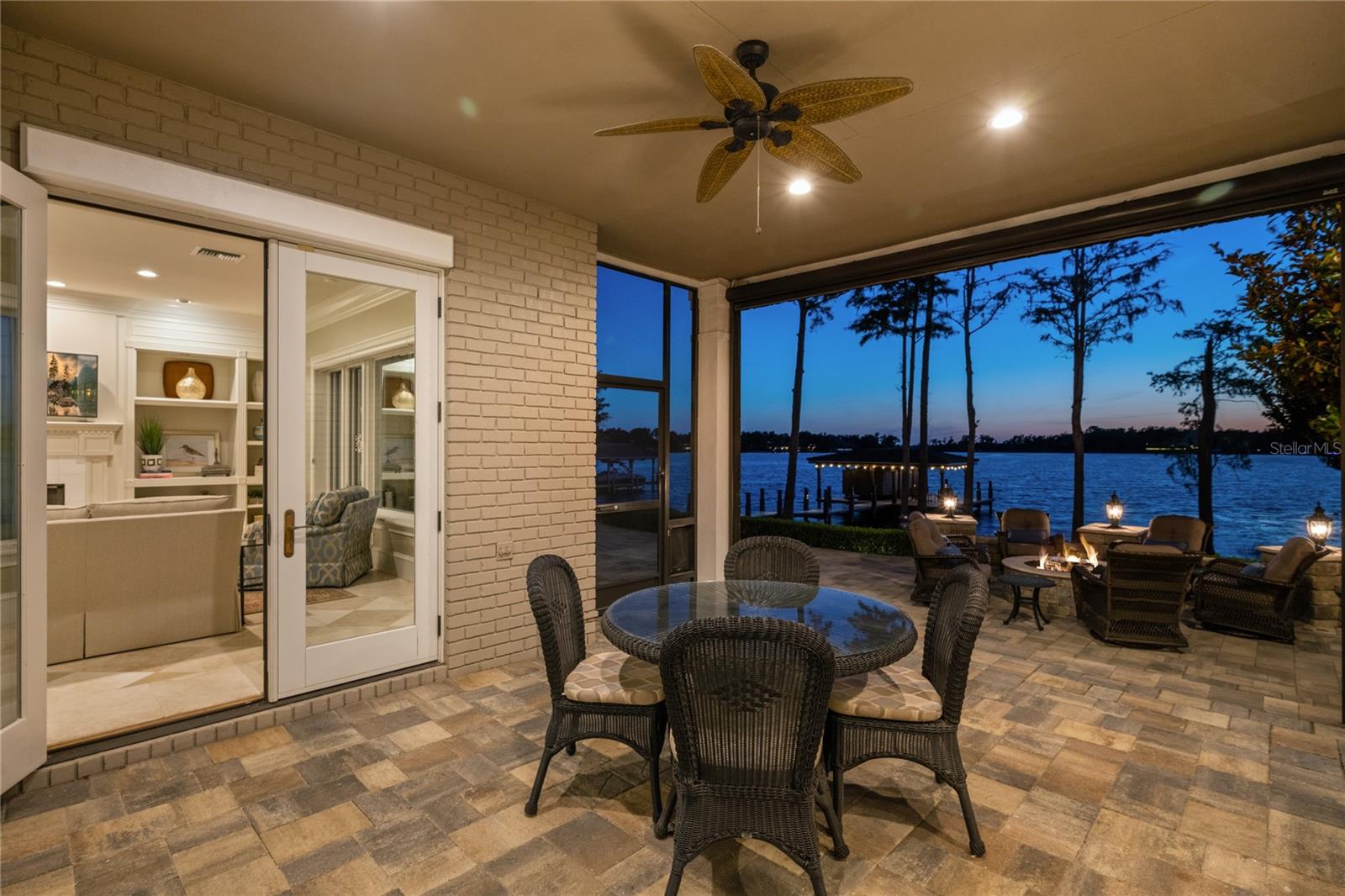 Screened patio accessible from both the great room and the kitchen, perfect for entertaining and alfresco dining.