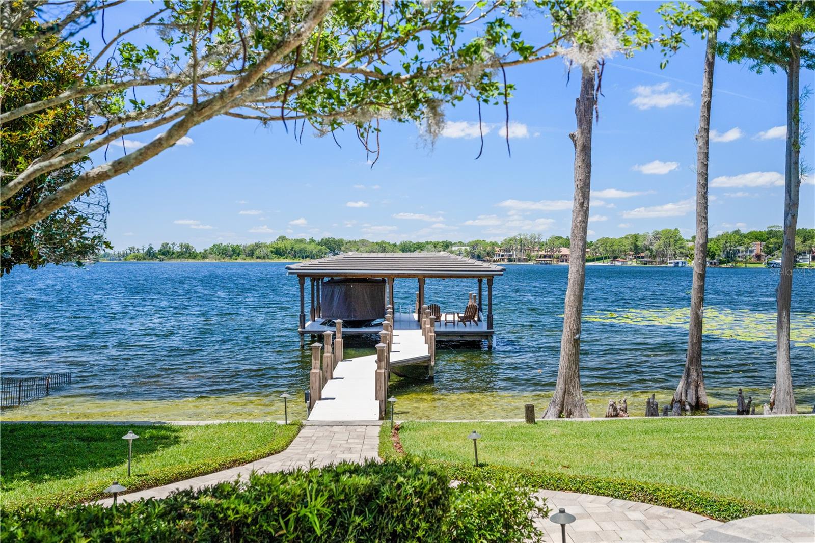 Unobstructed views! Enjoy 100 feet of private lake frontage on Wauseon Bay, from your backyard oasis.