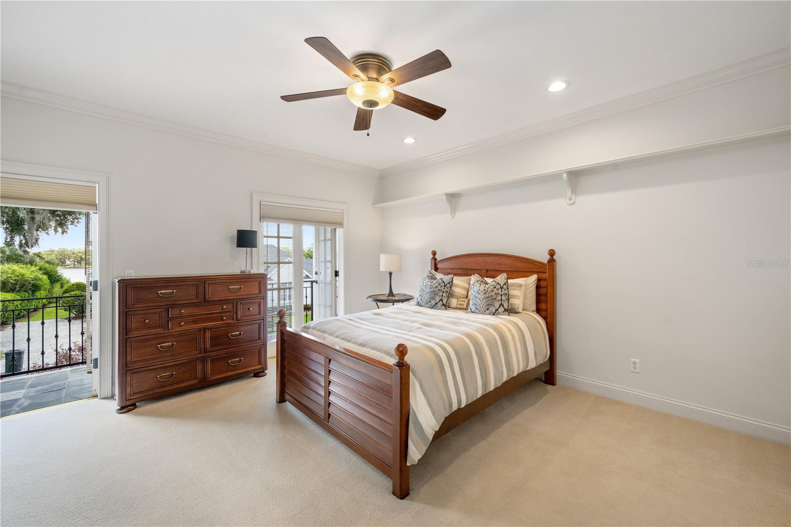 Bedroom #4, with built in desk, ensuite bath and balcony.