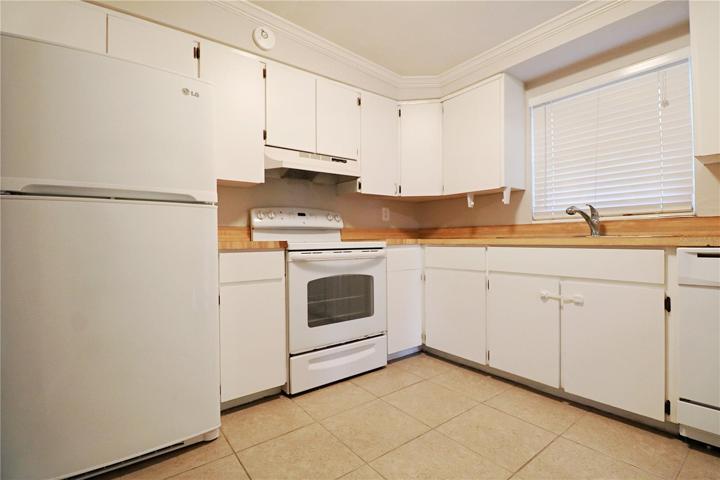 Kitchen offers range, refrigerator, and dishwasher