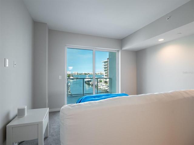 Master bedroom views to the marina through sliding doors to the private balcony