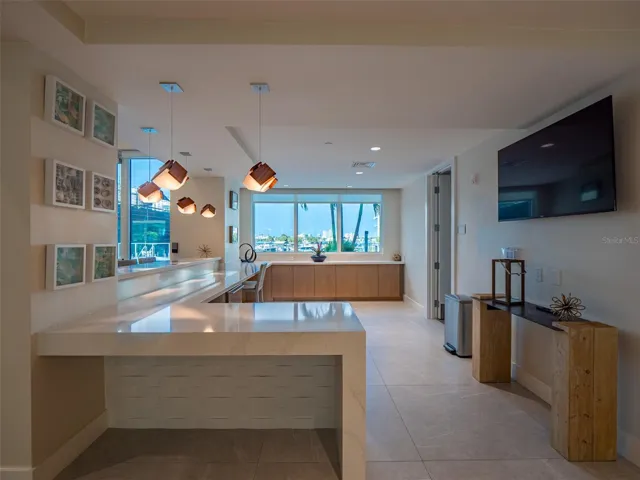 Club house kitchen and dining center with pool and marina views