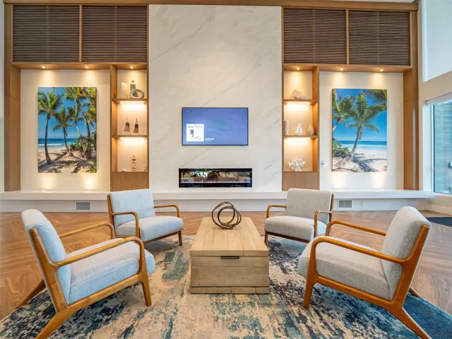 Club house lounge and movie center with pool and marina water views