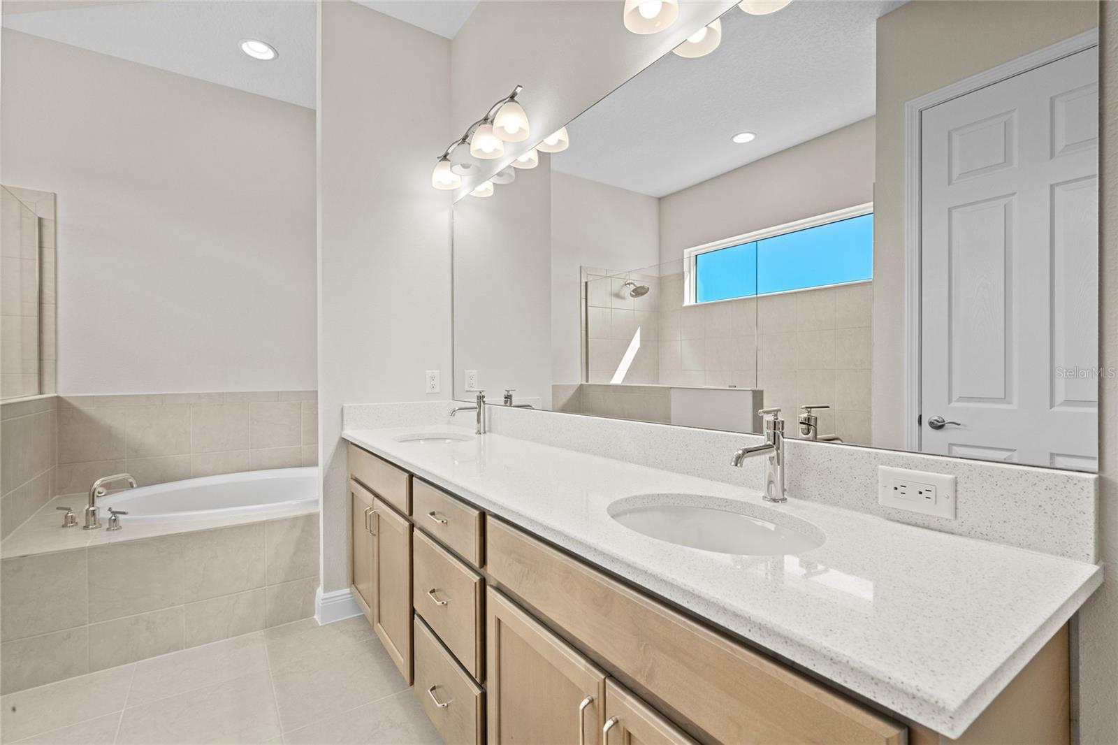 5 piece primary bath with linen closet, sot close cabinets.