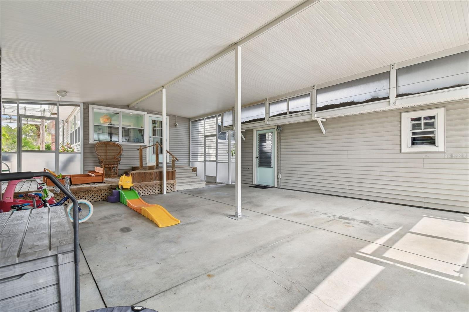 Garage on the right with side entrance. Easy covered access to the house.