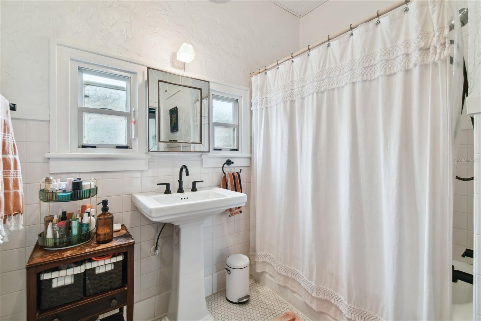 Master bath. Original vintage floors and tub.