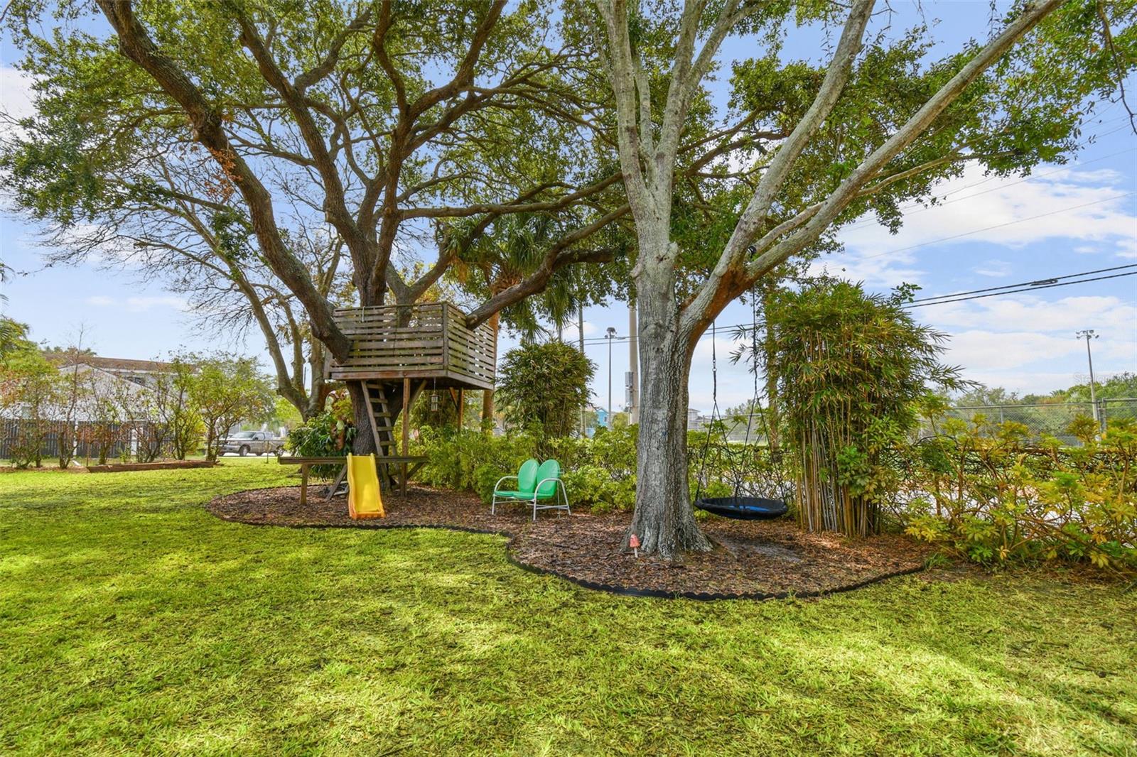 Double corner lot. Lush shrubbery and trees.