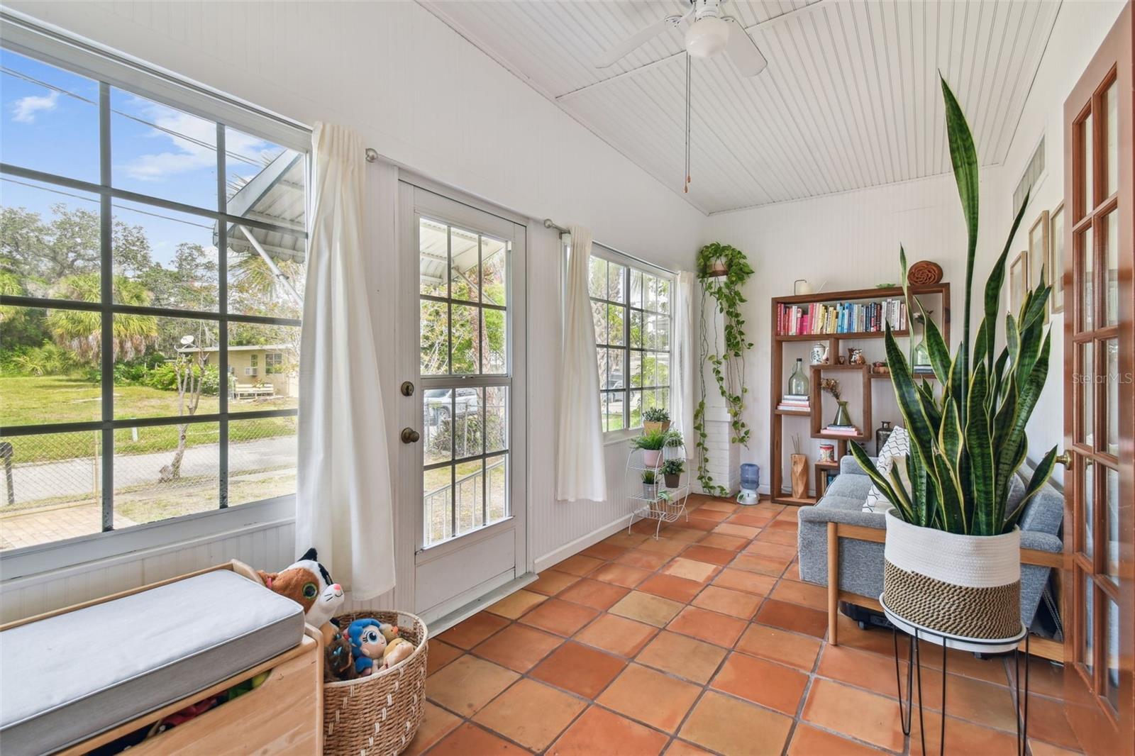 Enter into your enclosed sun room. Perfect bonus space for playing, relaxing or working out.