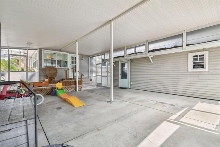 Garage on the right with side entrance. Easy covered access to the house.