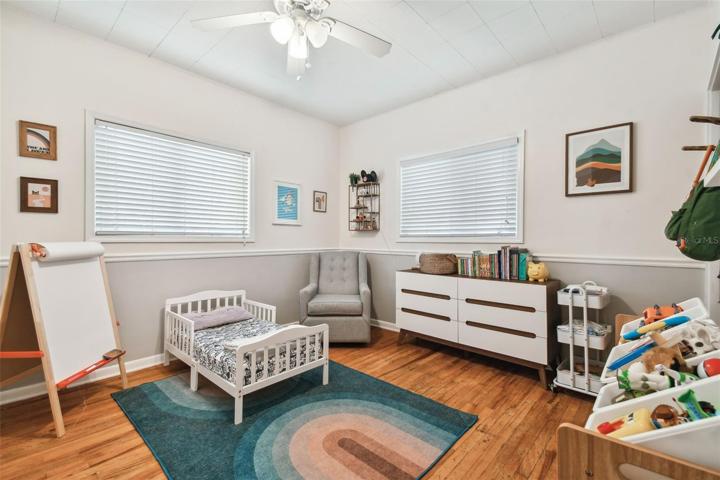 Bedroom three. Chair rail and original wood floors too!