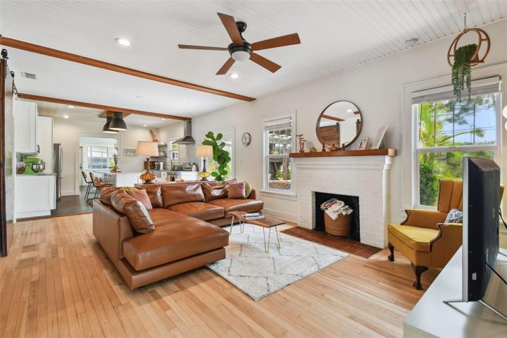 Original fireplace and mantel. Beautiful wood floors. Open concept kitchen - living room combo.