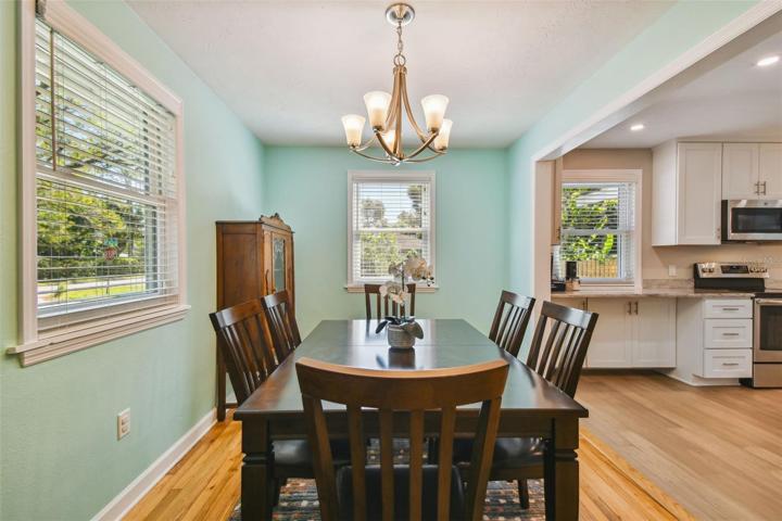 Formal dining conveniently located at front of home, open to the kitchen