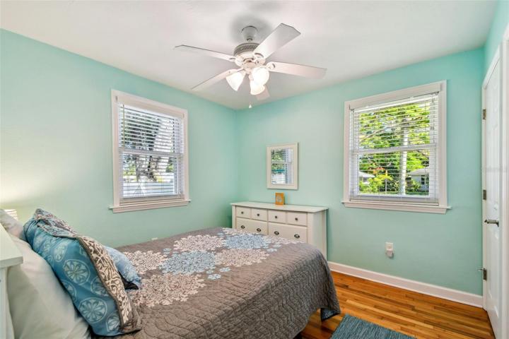 Guest bedroom 2 has lots of closet space and charming oak flooring
