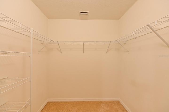 Walk In Closet In Primary Bedroom