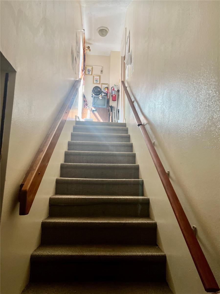 Over garage Stairs to bedroom &amp; bathroom.