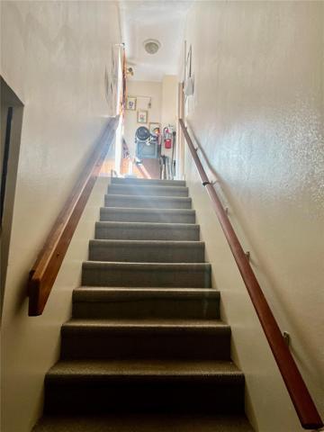 Over garage Stairs to bedroom &amp; bathroom.