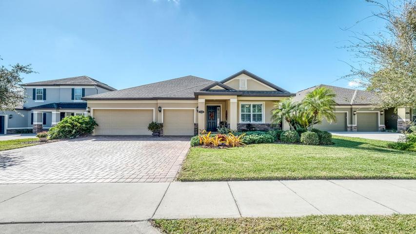Front view, 3 car garage, covered porch and entrance, wide lot, cleaned roof, mature landscaping