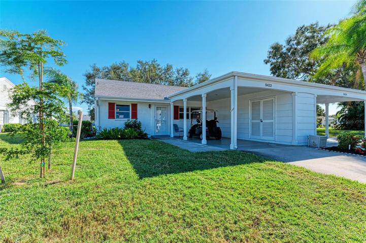 Front of villa with carport