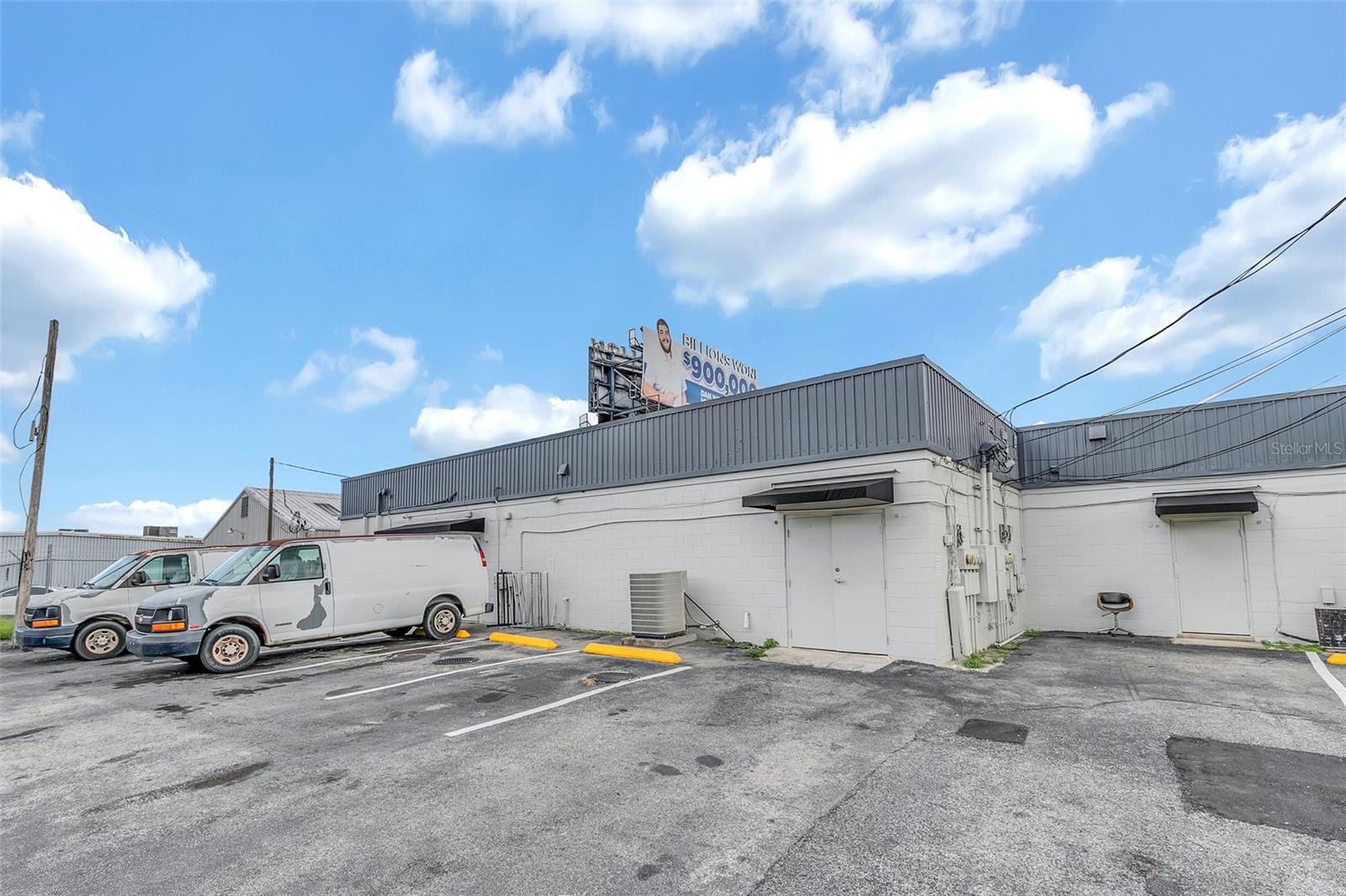 Backdoor and parking to Shop