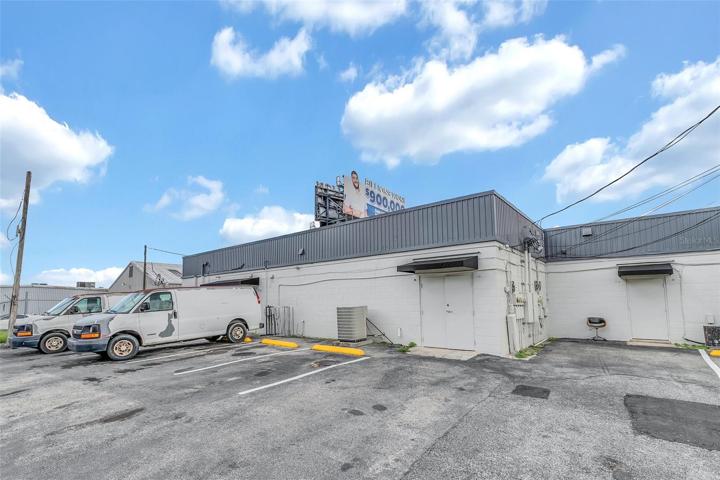 Backdoor and parking to Shop