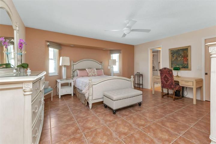 Door to left of the desk is a pocket sliding door to the walk-in closet