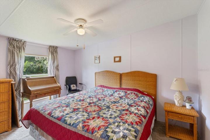 Bedroom 2 10x13 with vaulted ceiling, fan & standard closet