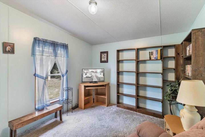 Bedroom 3 9x12 looking into backyard