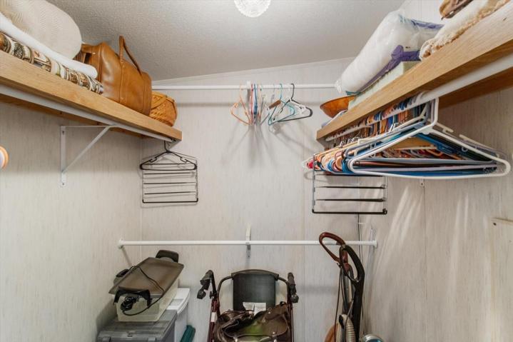Primary bedroom walkin closet has lots of room