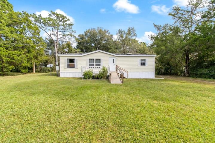 Lovely home on private 1/2 acre lot.  Driveway on right