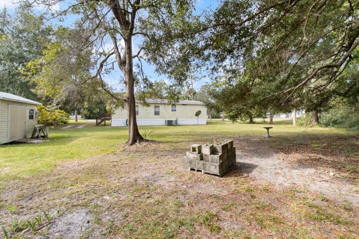 Large backyard has a 12 x 10 storage shed