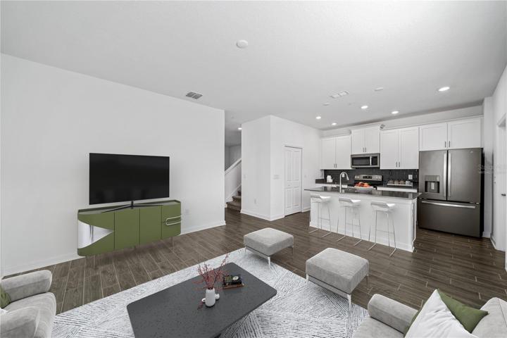 Virtually staged - Family room and kitchen just down the hall