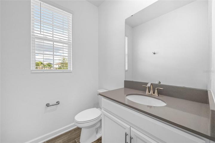 Downstairs half-bath between the living spaces