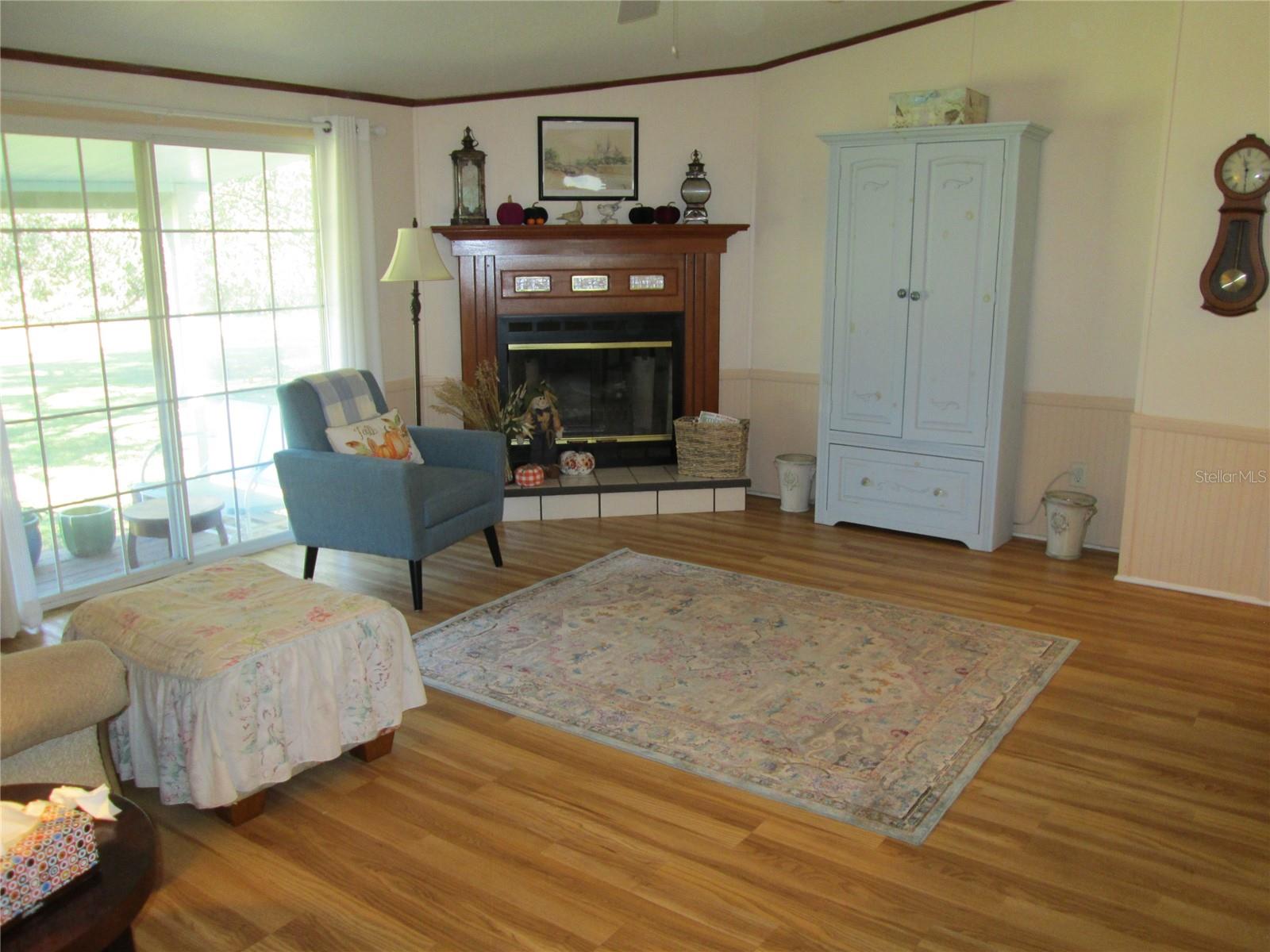 Family room looking from kitchen towards fireplace.