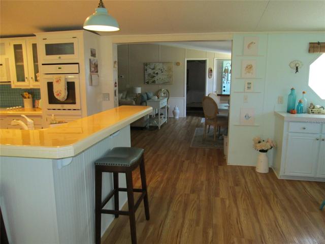 Kitchen looking into living room and dining area