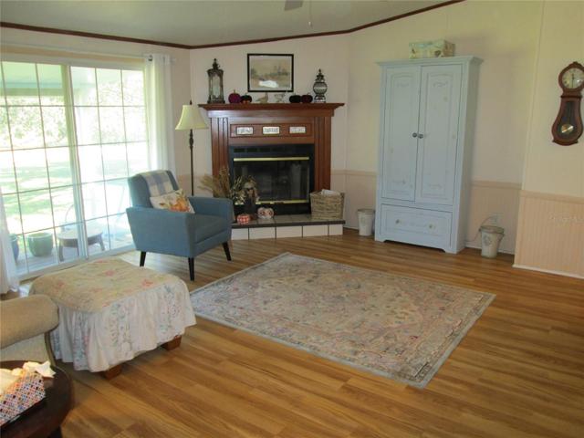 Family room looking from kitchen towards fireplace.