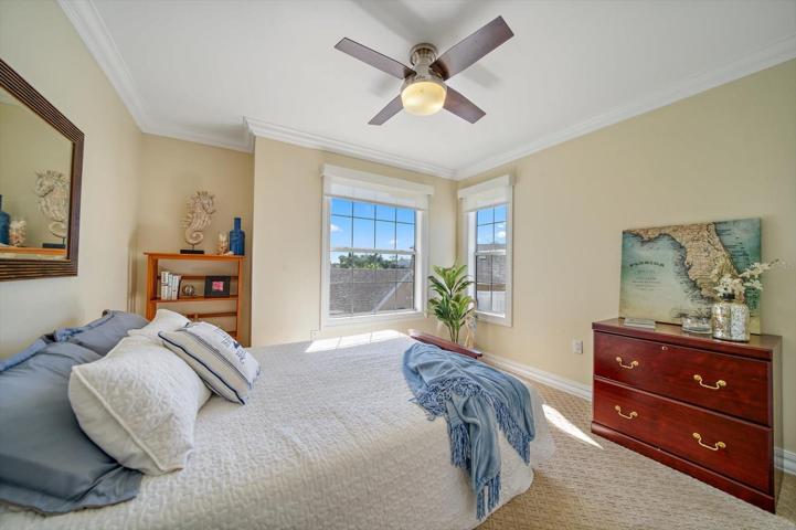 Second bedroom with water views and electronic shades.