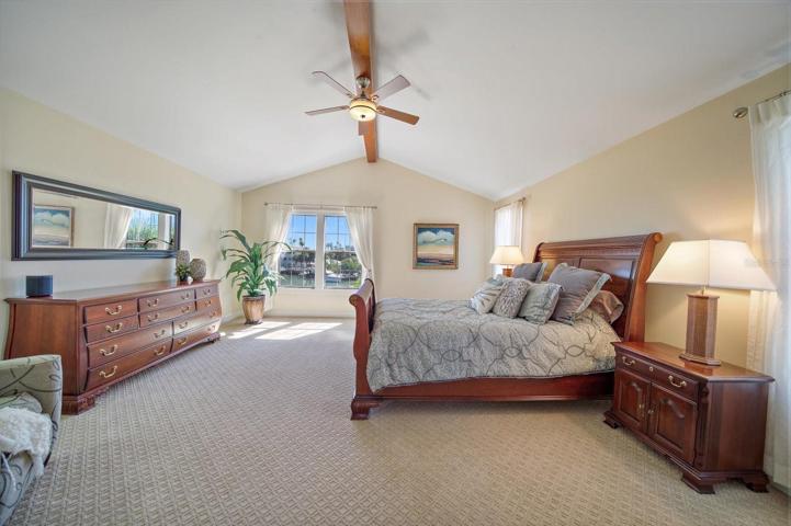 Primary retreat encompasses the entire third level for the ultimate in privacy. High vaulted ceilings with beam application.