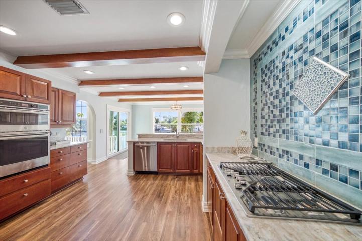 Top of the line new appliances, custom cabinets, gorgeous granite counters.
