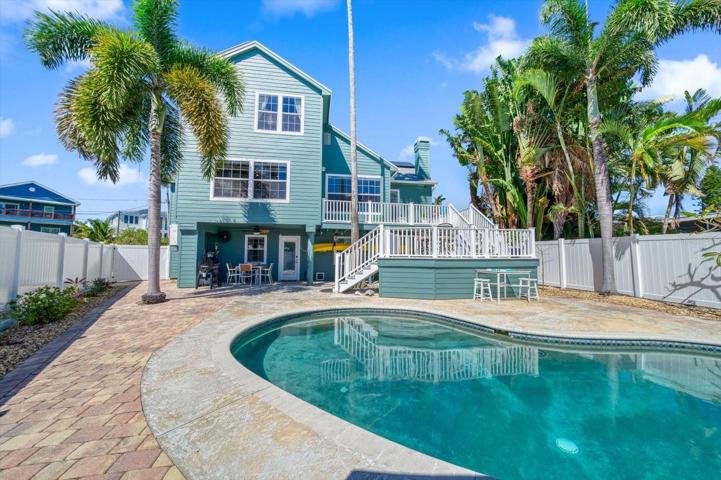 A fabulous setting-entertaining is a breeze by the pool, at the outdoor grill area, or fishing and boating at the dock..