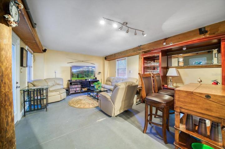 Ground level bonus room! Lots of possibilities for a multitude of uses;man cave, exercise area, craft center, separate office..