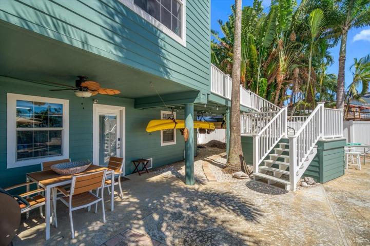 Outdoor covered lower patio-perfect for kayaks and additional watercraft items.