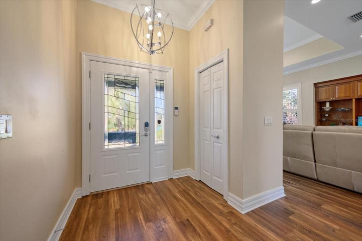 Attractive entry with natural light reflecting tasteful finishes throughout.