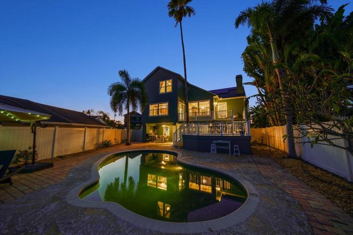 Privacy abounds on the deck, or in the pool in the fenced rear yard.