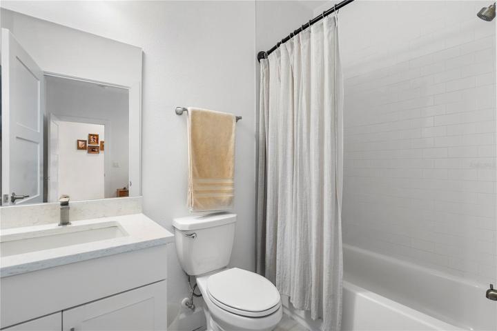 Guest en suite bathroom with bath tub and shower