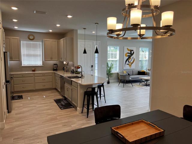 View from the dining room of the Kitchen, Front Door and Living Room