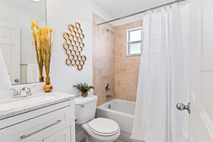 Guest bathroom with tub