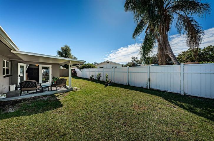 Fully fenced in yard with vinyl fencing