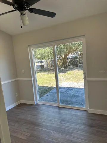 Bonus room with sliding glass doors to backyard